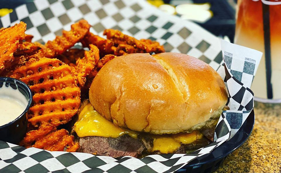 Basket of cheeseburger with waffle fries